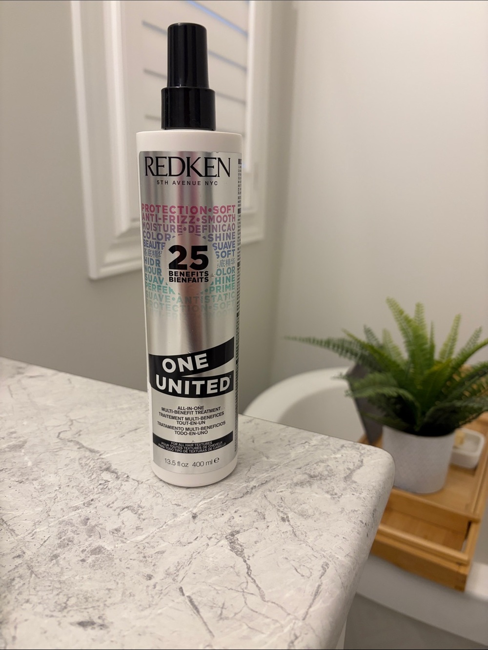 Redken One United Multi-Benefit Spray — White with Black Cap